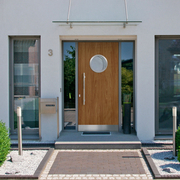 Außentür in Holzoptik mit Bullauge kaufen